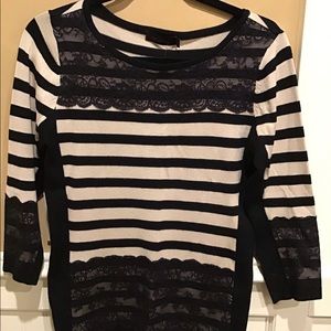 camel and black sweater with lace embellishments